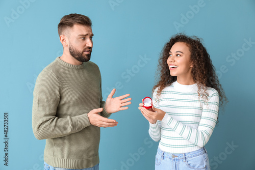 Young woman proposing to he...