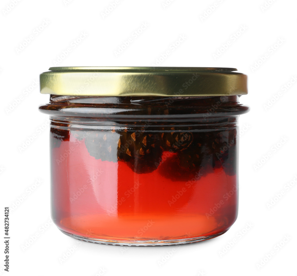 Jar of tasty pine cone jam on white background