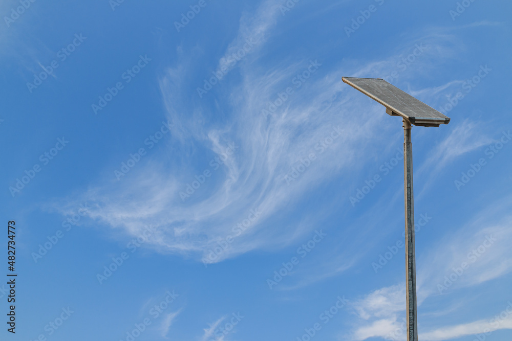 Solar cell street lamp pole with thin white clouds sky background Solar cell street lamp pole with thin white clouds sky background