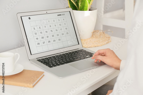 Woman working with calendar...