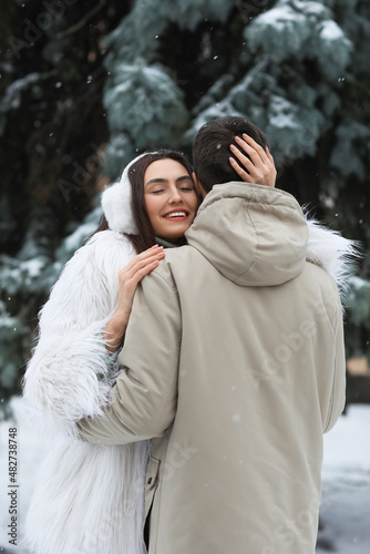 Loving couple hugging in pa...