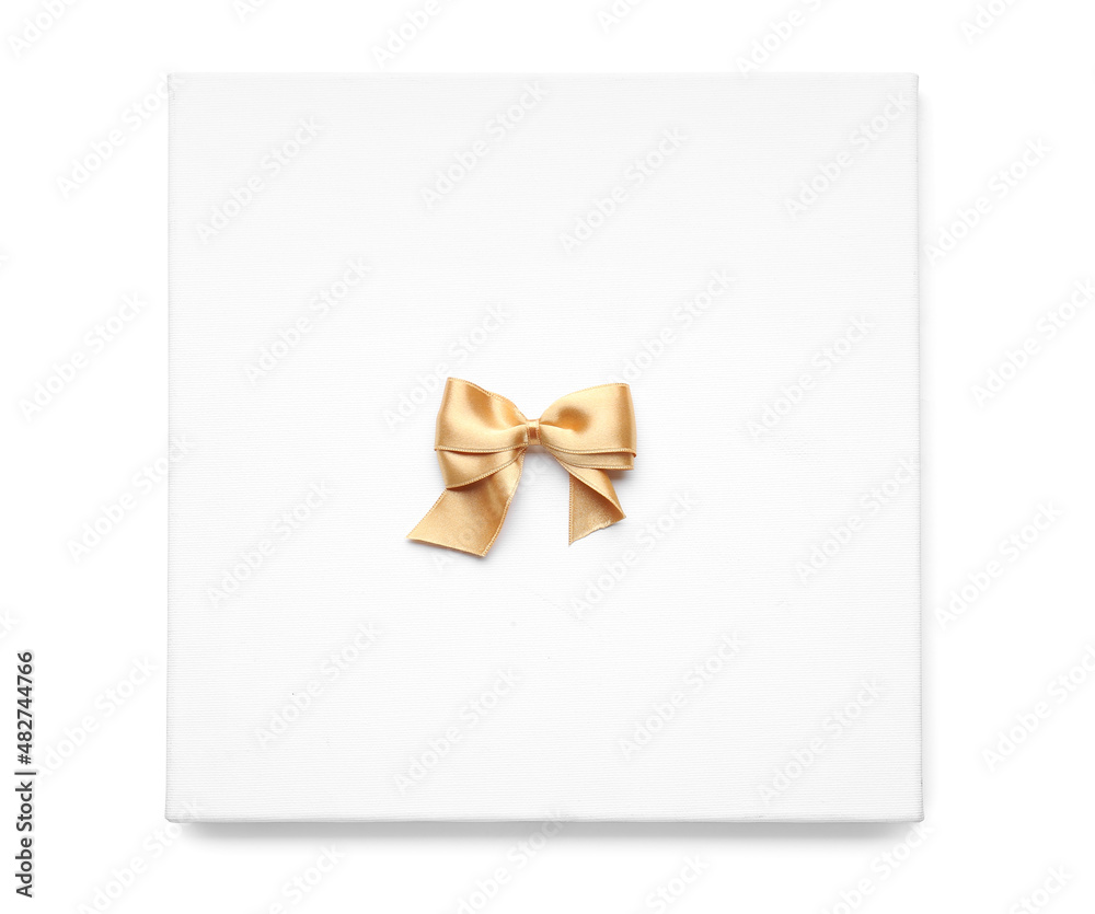 Board with golden ribbon bow on white background Board with golden ribbon bow on white background