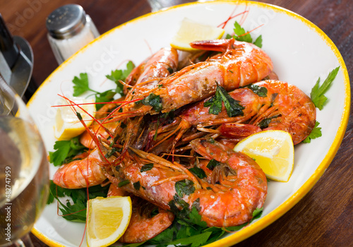 Grilled shrimps with lemon and parsley. High quality photo