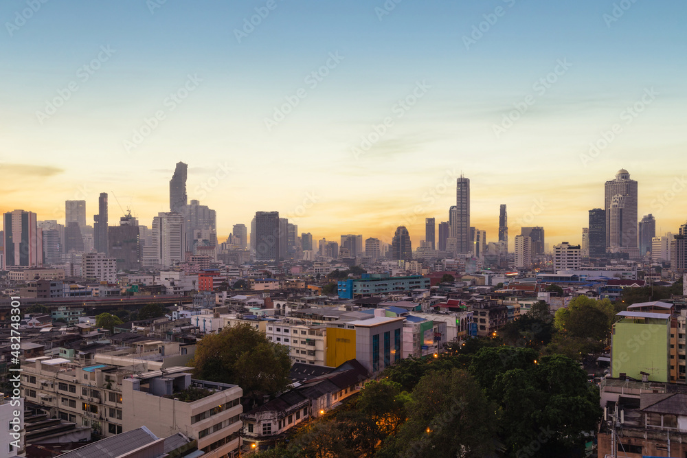 Aerial view of modern office buildings in Bangkok's downtown with sunrise time, Bangkok, Thailand