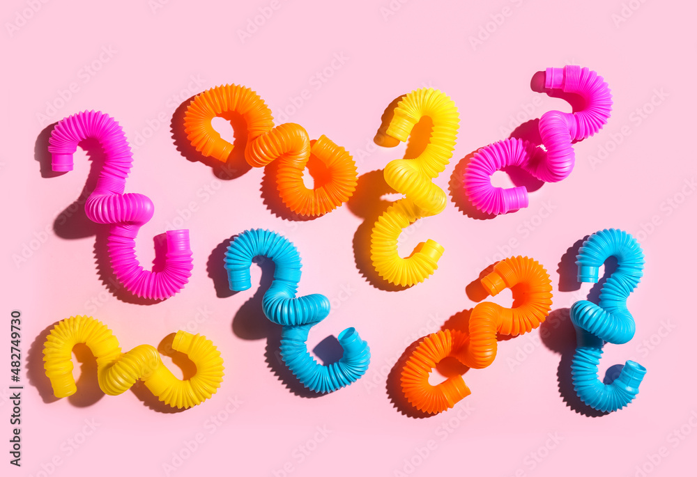 Pop Tubes on pink background Pop Tubes on pink background