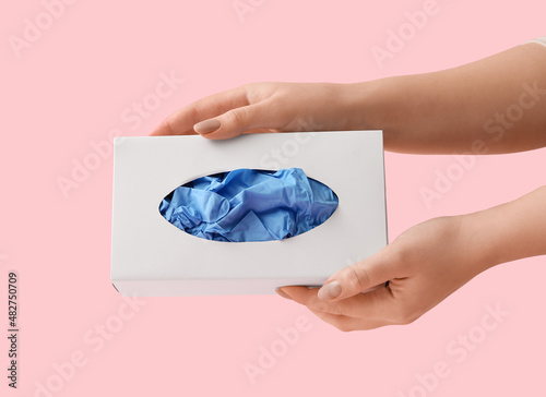 Female hands holding a whit...