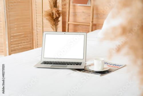 Laptop with cup of coffee a...