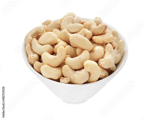 Bowl of tasty organic cashew nuts isolated on white