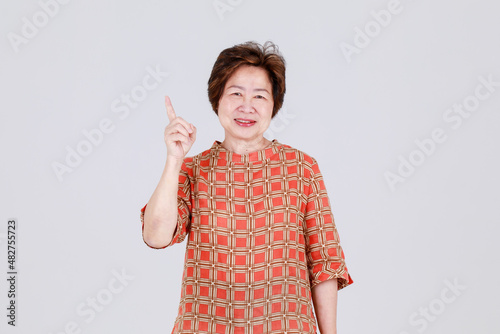 Healthy chinese senior woman happy and glad to cheer proposal of sale promotion notice and offer great campaign opportunity as recommeded advertisement for elderly customer photo