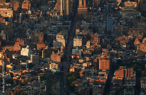 Sunset in New York, view from above. Amazing sun light over Manhattan and Hudson river during a sunset, images taken from the highest building in the city. Impressive architecture. Landmark of America