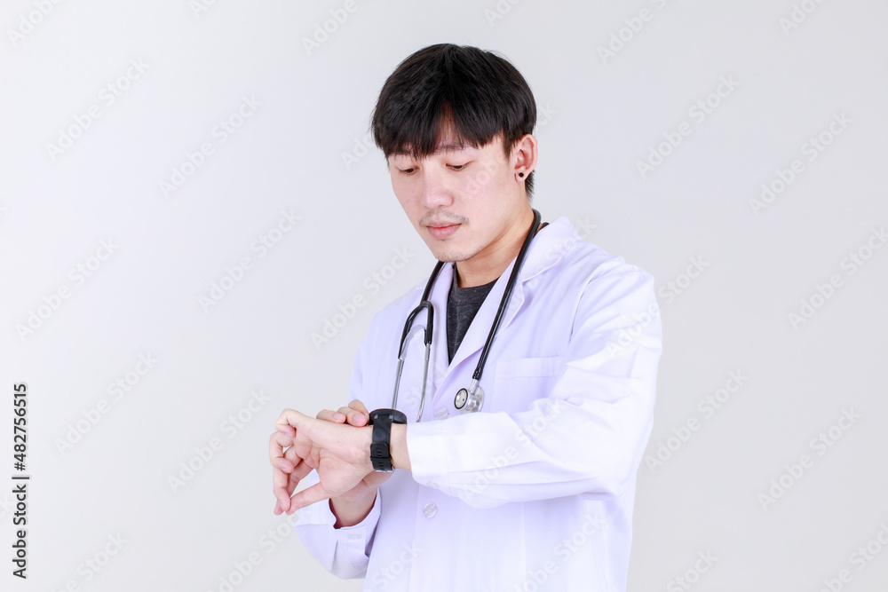 Smart young chinese physician on medical professional gown with stethoscope smile with confident and happy to success disease treatment with safe. Doctor pleased and ensure health care. Smart young chinese physician on medical professional gown with stethoscope smile with confident and happy to success disease treatment with safe. Doctor pleased and ensure health care.