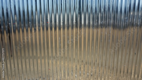 Galvanized fence blocking the temporary office