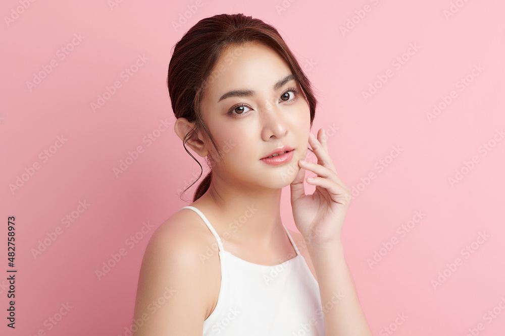 Beautiful young asian woman with clean fresh skin on pink background, Face care, Facial treatment, Cosmetology, beauty and spa, Asian women portrait. Beautiful young asian woman with clean fresh skin on pink background, Face care, Facial treatment, Cosmetology, beauty and spa, Asian women portrait.