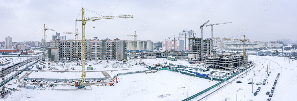 winter aerial panoramic view of large construction site in residential district winter aerial panoramic view of large construction site in residential district