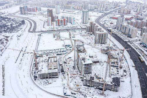 aerial panoramic view of large construction site in winter. new residential district under construction.