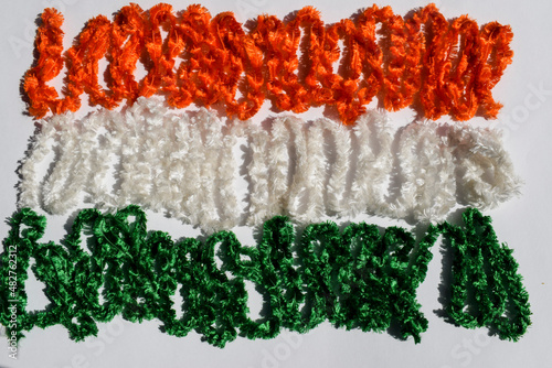 Happy republic day and Happy independence day of India greeting card background poster to write wishes fonts text. India tricolour flag concept made with decorative spiral ribbons photo