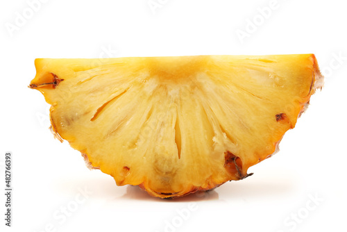 slice of pineapple on white.