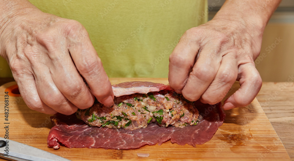 Chef wraps the minced meat in the meat to make meatloafs. French gourmet food