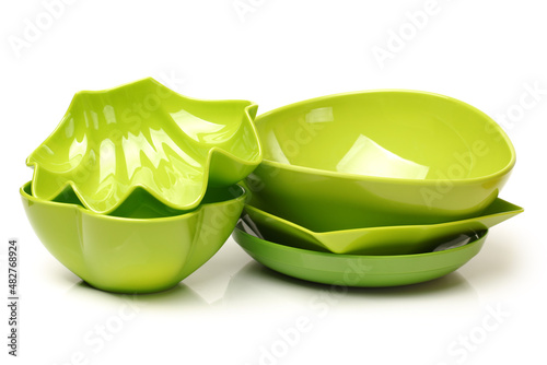 Bright green plastic empty bowl on a white background 