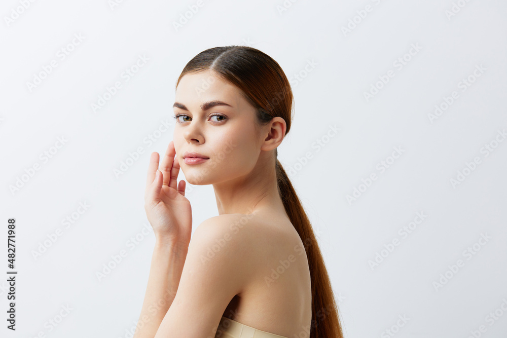 woman smiling woman bare shoulders clean skin charm Model light background woman smiling woman bare shoulders clean skin charm Model light background