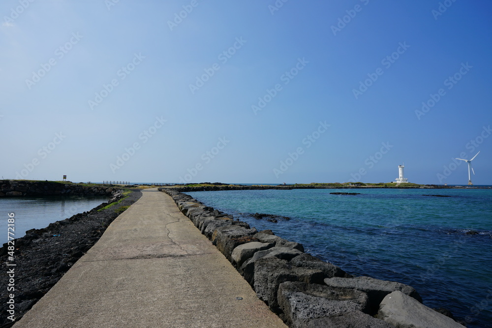 seaside walkway and wind power plant