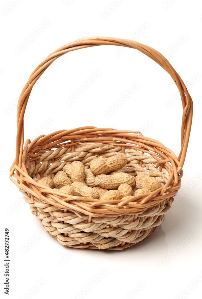 basket of peanuts isolated on white
