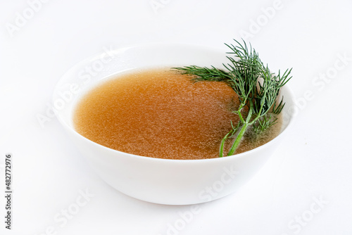 close up of a bowl of chicken broth
