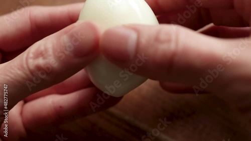 Wallpaper Mural Female hands crack a hard-boiled egg open in half. Torontodigital.ca