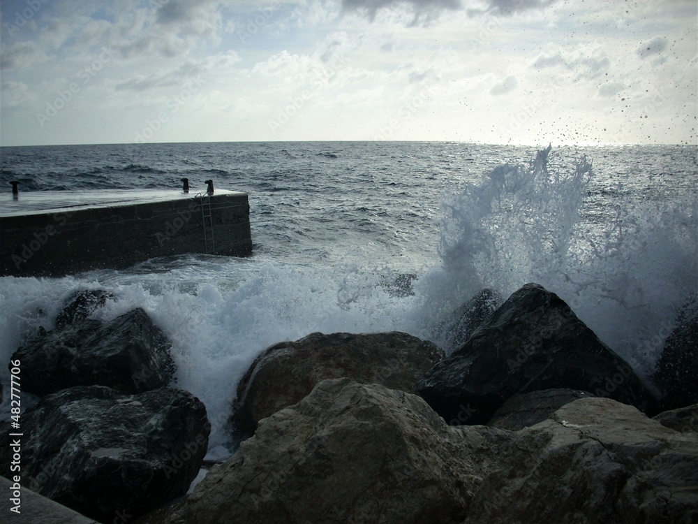 waves crashing on rocks