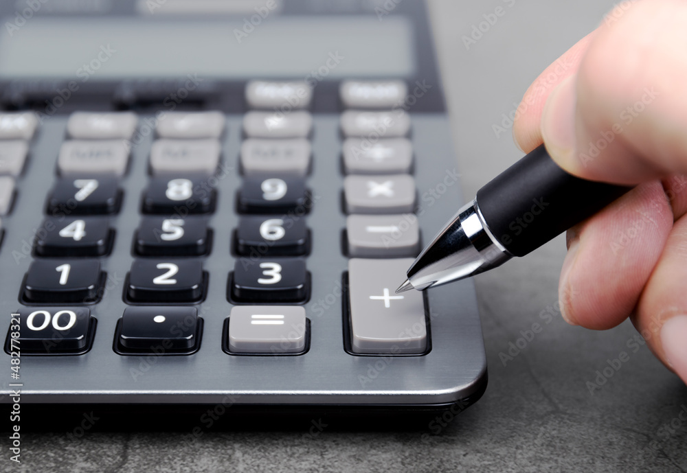 The pen pointing to the add button in the calculator The pen pointing to the add button in the calculator