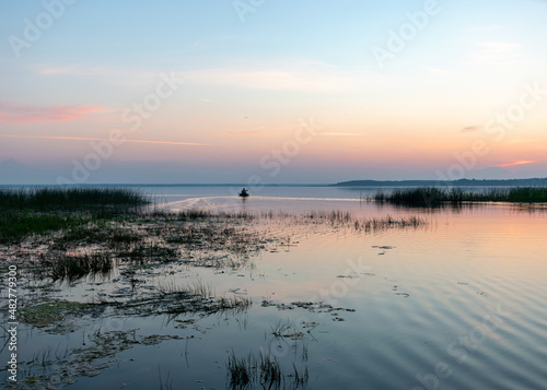 summer landscape on the shore of the lake at dawn  colors in the sky before sunrise  Lake Burtnieki  Latvia