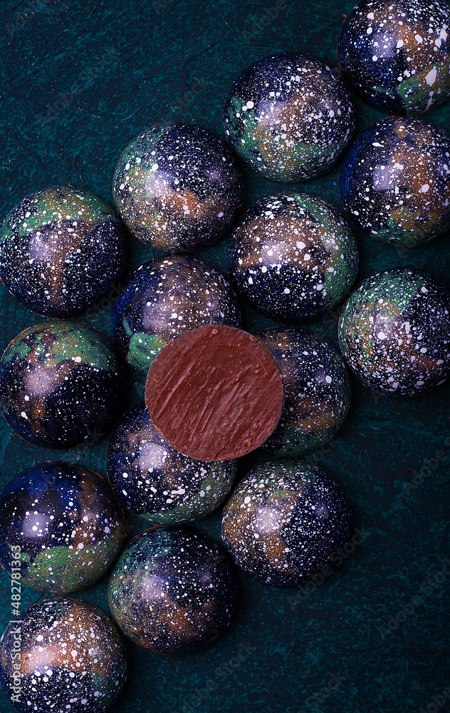Chocolates, handmade, close-up, top view, on a dark background, vertical, no people, Chocolates, handmade, close-up, top view, on a dark background, vertical, no people,