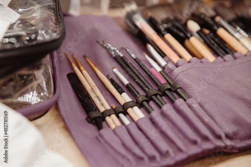 Make up brushes. Cosmetic brushes pallets. Professional make up tool on table