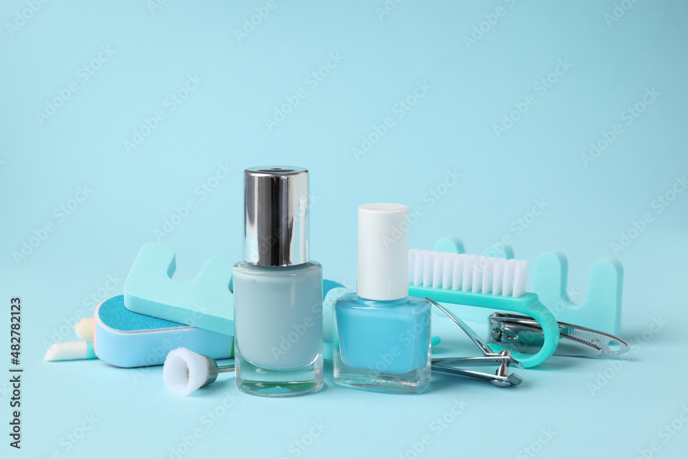 Concept of nail care with manicure accessories on blue background Concept of nail care with manicure accessories on blue background