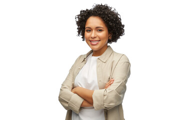 people, ethnicity and portrait concept - happy smiling woman in shirt with crossed arms over white background