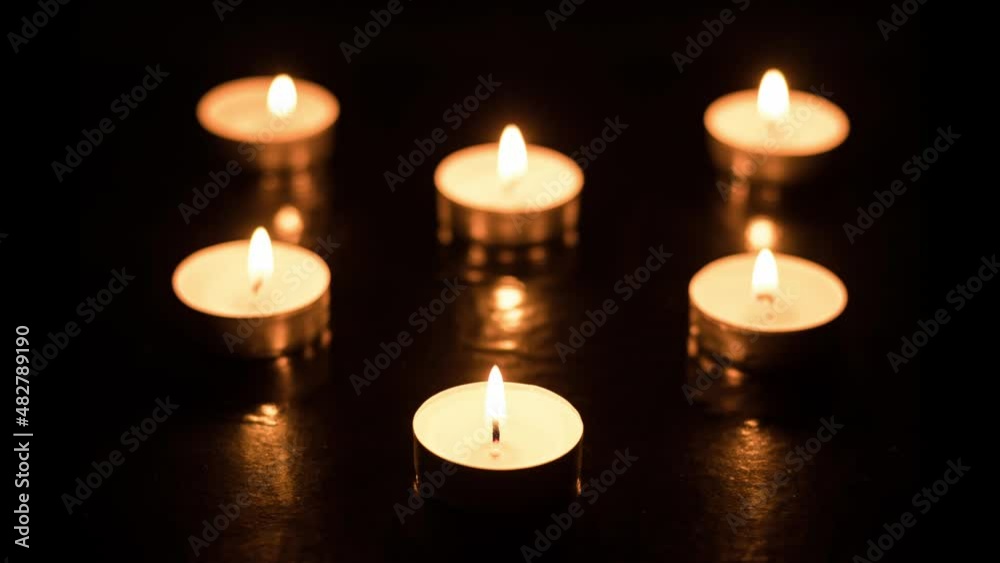Burning candles until the end on dark table (black background) Memory day, time lapse Burning candles until the end on dark table (black background) Memory day, time lapse