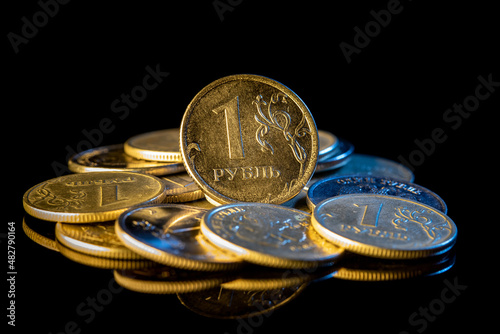 Russian ruble coins on a black background. photo