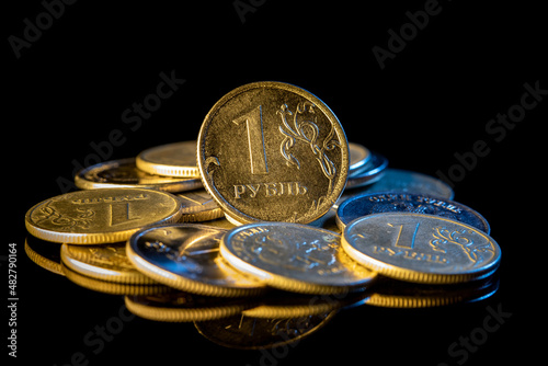 Russian ruble coins on a black background.