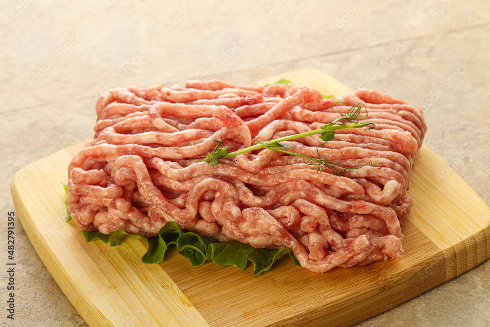 Raw minced pork meat over board Raw minced pork meat over board