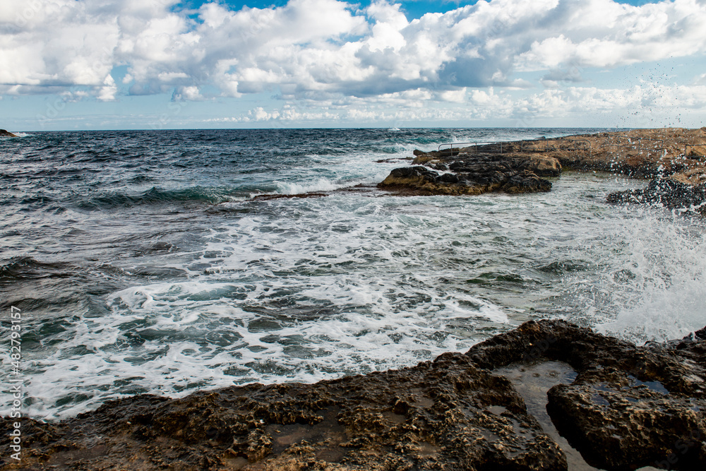 Malta, sea waves crash against the rocks
