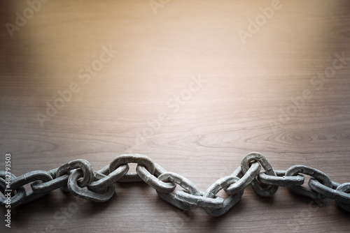 metal chain on wooden background 