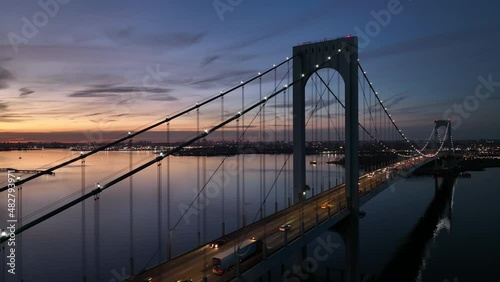 evening flying around Bronx Whitestone Bridge revealing NYC in bkrd photo