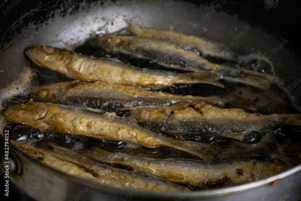Fried herring on a frying pan. Fried herring on a frying pan.