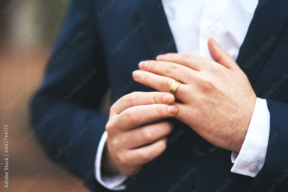 He's ready to tie the knot. Cropped shot of an unrecognizable bridegroom adjusting his ring on his wedding day.