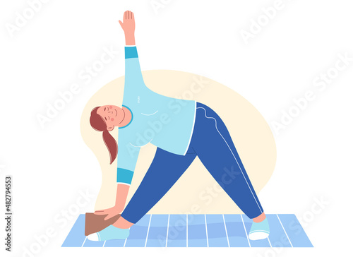 Aerobic, fitness and yoga classes. Overweight young woman stands in Trikonasana triangle pose. Concept of healthy lifestyle and sports for weight loss.