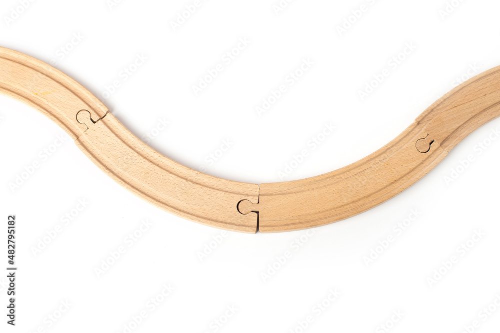 Wooden toy railroad track. Conceptual image of connection, pieces and travel Wooden toy railroad track. Conceptual image of connection, pieces and travel