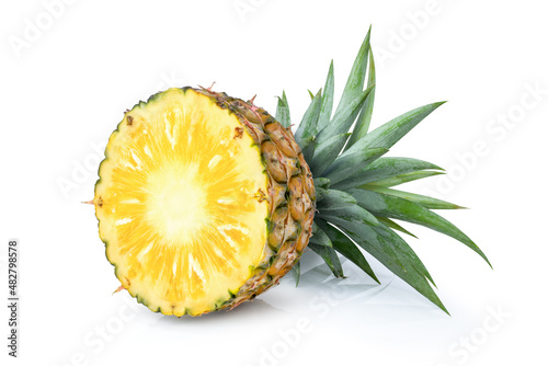 Pineapple half sliced with crown isolated on white background. 