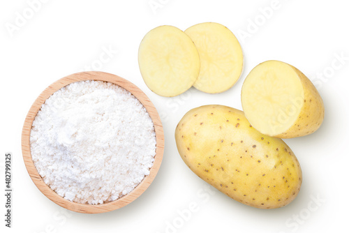 Potato starch (ground potato) in wooden bowl and fresh potatoes with slice isolated on white background. 