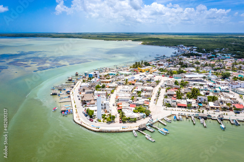 Aerial landscape overlooking the city of Rio Lagartos. The city is surrounded by a beautiful river with azure water. Fishing boats are moored to the shore. Yucatan, Mexico photo