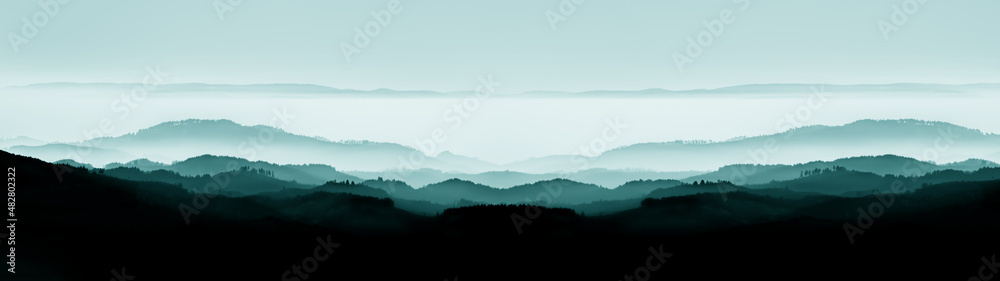 Amazing mystical rising fog forest trees mountains landscape panorama in Black Forest ( Schwarzwald ) Germany with dark silhouette